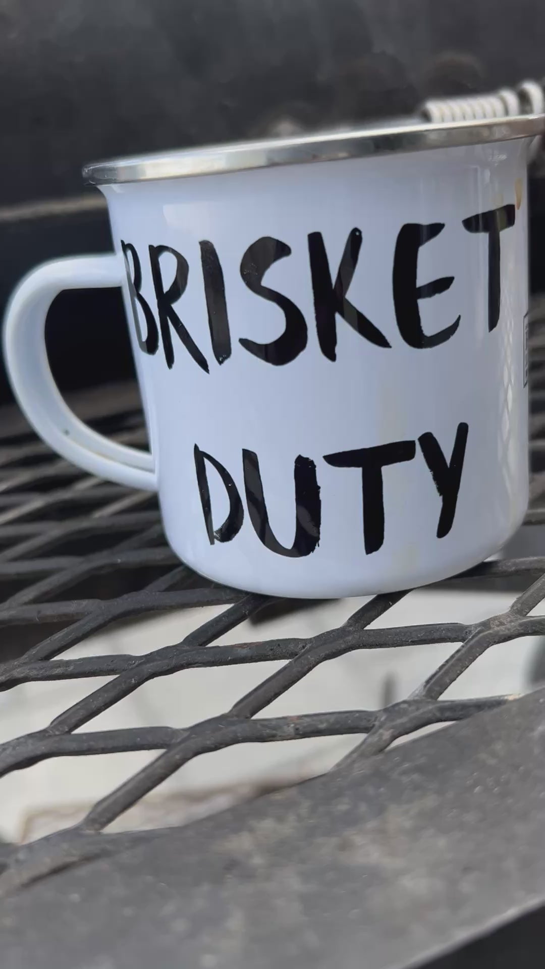 12 oz ‘Brisket Duty’ Enamel Mug by Hook’s Rub – a lightweight, durable, and multifunctional mug perfect for pitmasters during overnight smokes. Ideal for coffee, cocktails, or hot cheesy grits, it features a white coating with a silver rim and measures 3.14″ in height and 3.25″ in diameter. Hand-wash only; not dishwasher or microwave safe breakfast  smoker